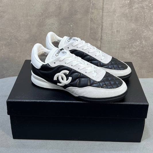Chanel 26s Sneakers In Black And White Quilted Calfskin CC Logo
